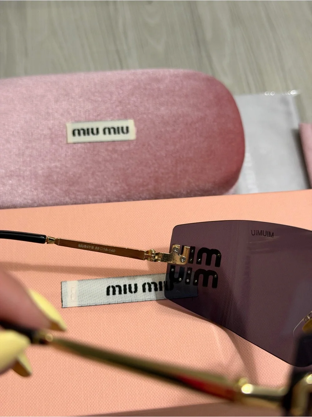 Miu Miu Purple Lens Frameless Sunglasses with Gold Accent